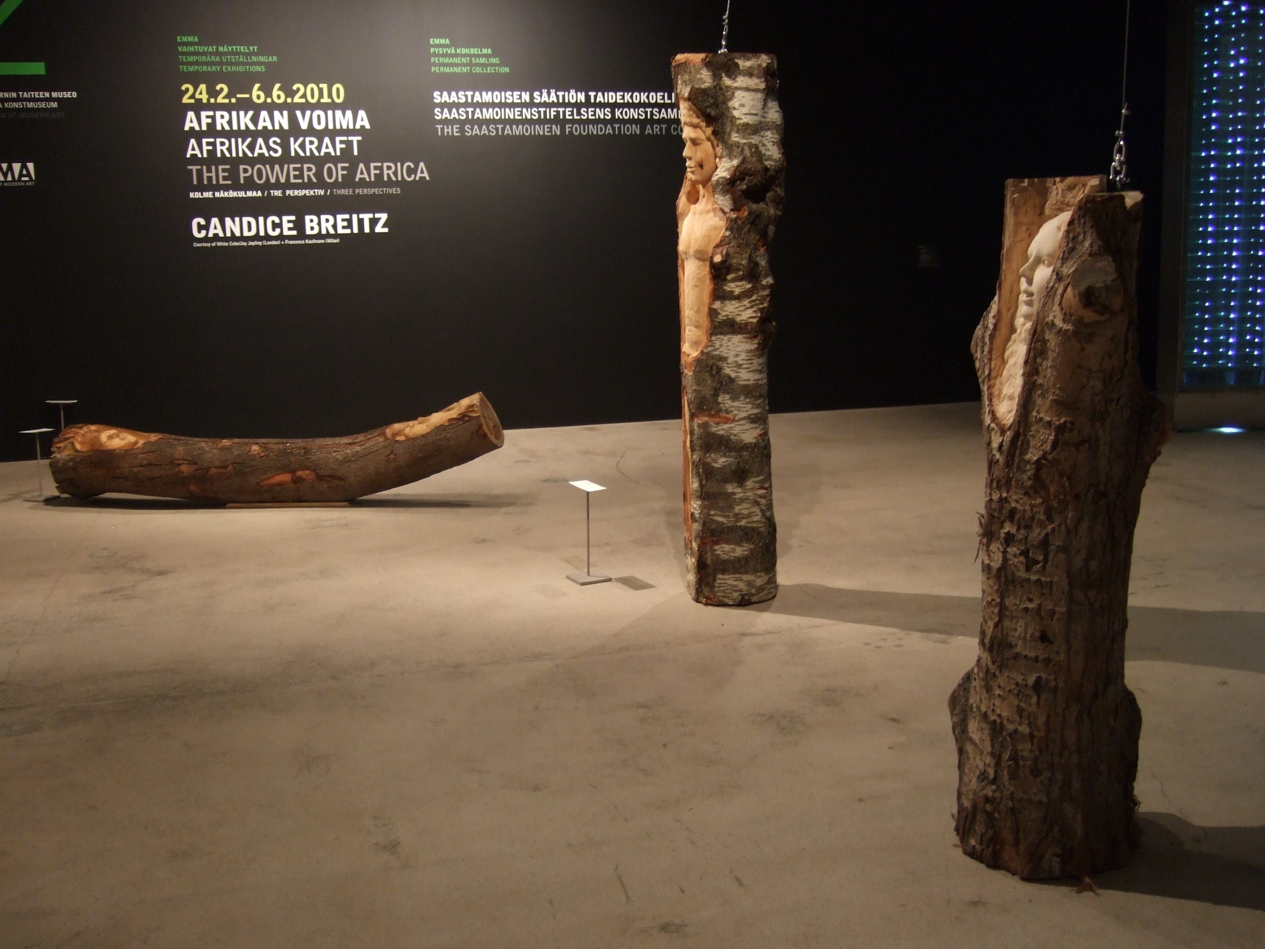 Wooden sculptures carved from tree trunks at Sanna Karlsson-Sutisna's Iroko exhibition, EMMA – Espoo Museum of Modern Art, 2010.
