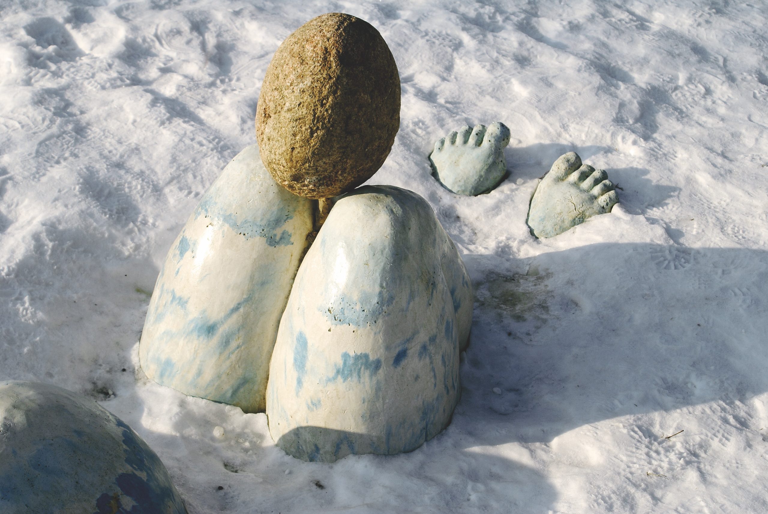 Public Artwork - Flower of Life - Sculptural forms resembling two eggs, a stone sphere, and a pair of feet emerging from the snow. - Art park, Pikku-Huopalahti, Helsinki, 2005.