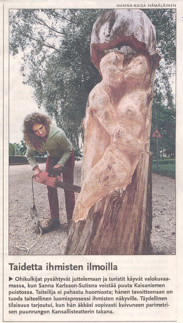 Newspaper article showing Sanna Karlsson-Sutisna carving a public tree sculpture in Kaisaniemi Park, Helsinki, during its creation.